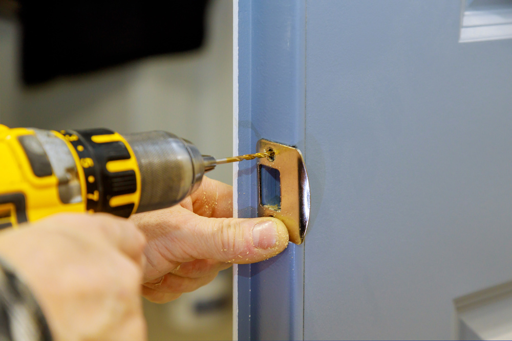 Handyman Installing Door Lock